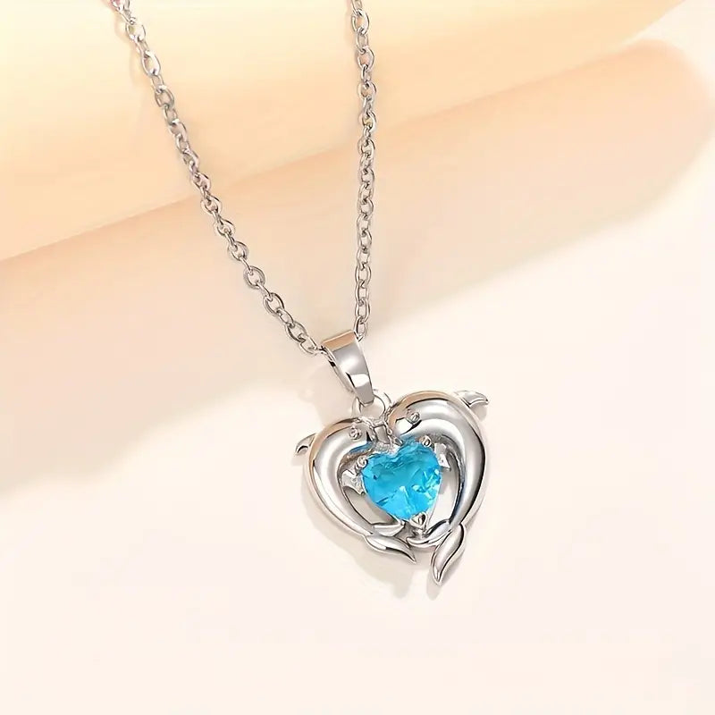 Amira – Ciondolo a forma di cuore con zaffiro.