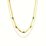 Annelie – Collana con dettagli in smeraldo e oro.