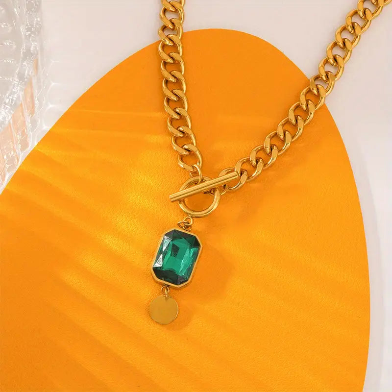 Tereza – Collana in oro con ciondolo di smeraldo.