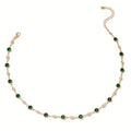 Annalena – Collana di smeraldi con dettagli in oro.