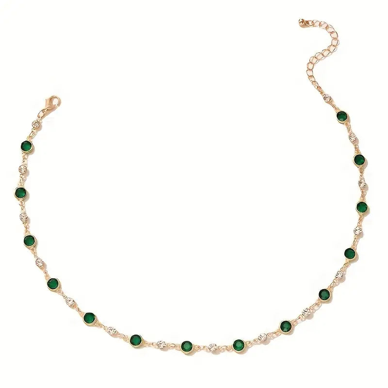Annalena – Collana di smeraldi con dettagli in oro.