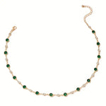 Annalena – Collana di smeraldi con dettagli in oro.