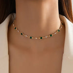 Annalena – Collana di smeraldi con dettagli in oro.