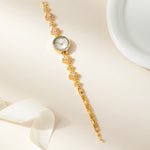 Elina – Orologio in oro con bracciale a fiori.