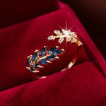 Aurelie – Anello in oro rosso con pietra blu
