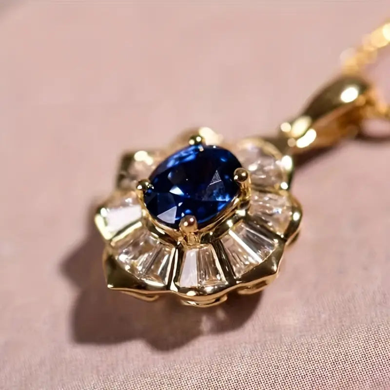 Amélie – Collana con pendente in zaffiro sfaccettato.