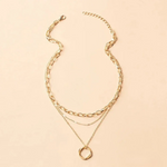Beata – Collana dorata con piccole decorazioni in pietra
