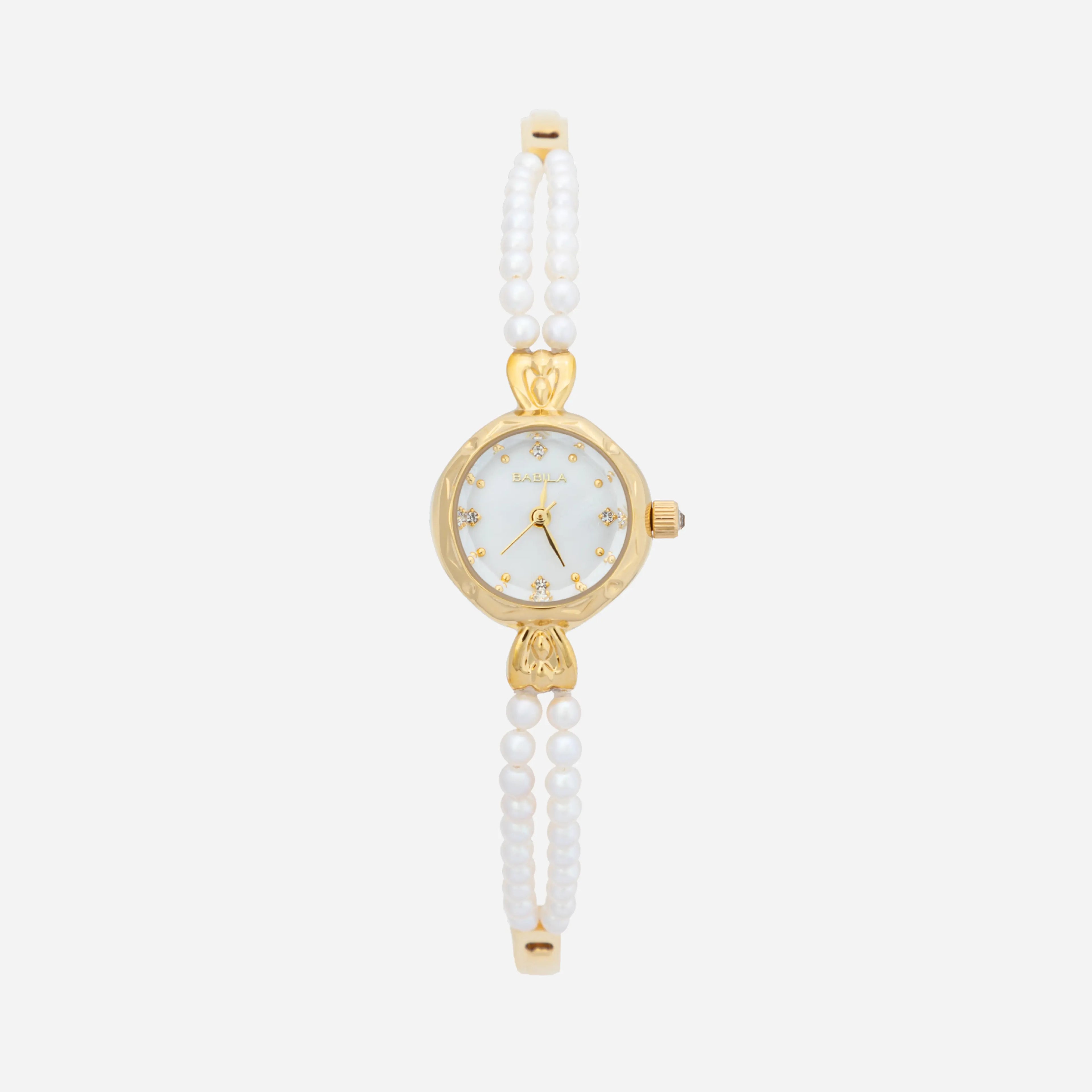 Johana – Orologio in oro con bordo in cristallo.