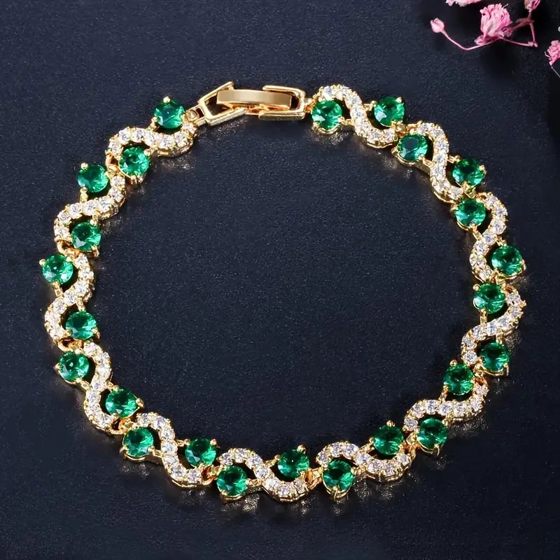 Celina – Orologio da polso color smeraldo con dettagli in oro.