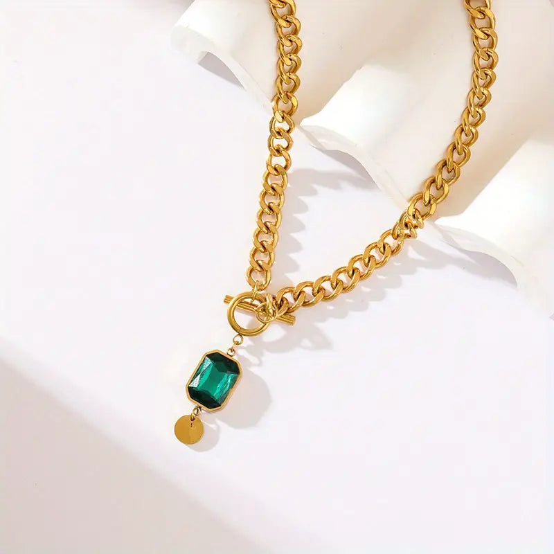 Tereza – Collana in oro con ciondolo di smeraldo.