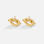 Romana – Orecchini in oro dalla forma intrecciata.