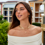 Carina – Mini cerchi dorati con una linea chiara.