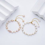 Carina – Orecchini in oro con perle mobili.