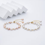 Carina – Orecchini in oro con perle mobili.