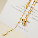 Johana-Luisa – Orecchini in oro con doppia perla.