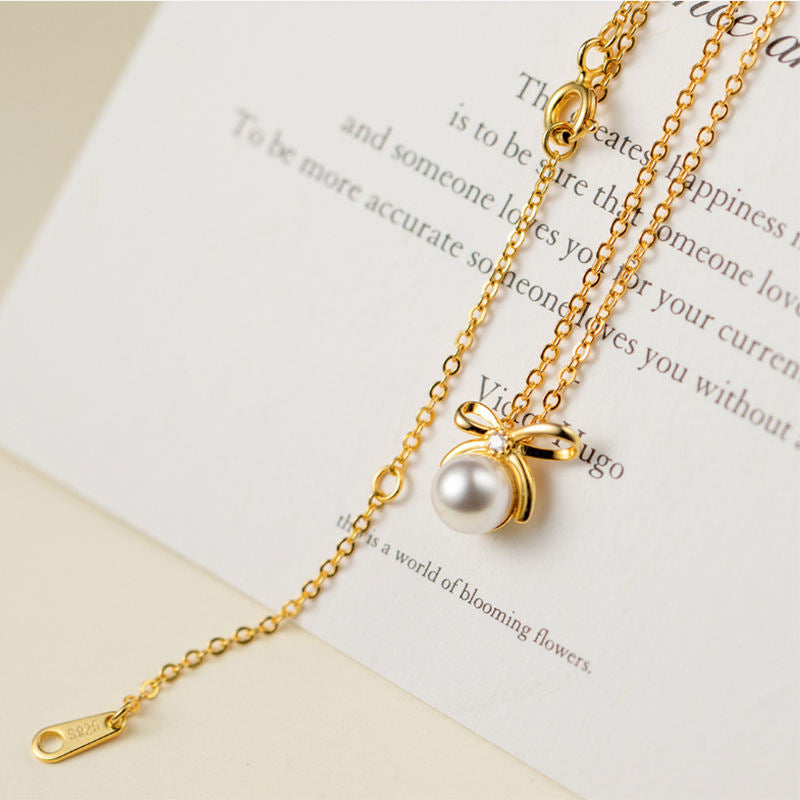 Johana-Luisa – Orecchini in oro con doppia perla.