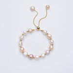 Carina – Orecchini in oro con perle mobili.
