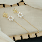 Victoria – Collana di perle con riflessi dorati.