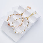 Carina – Orecchini in oro con perle mobili.