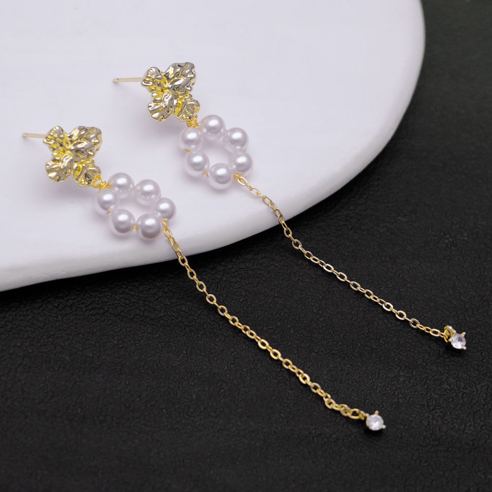 Victoria – Collana di perle con riflessi dorati.