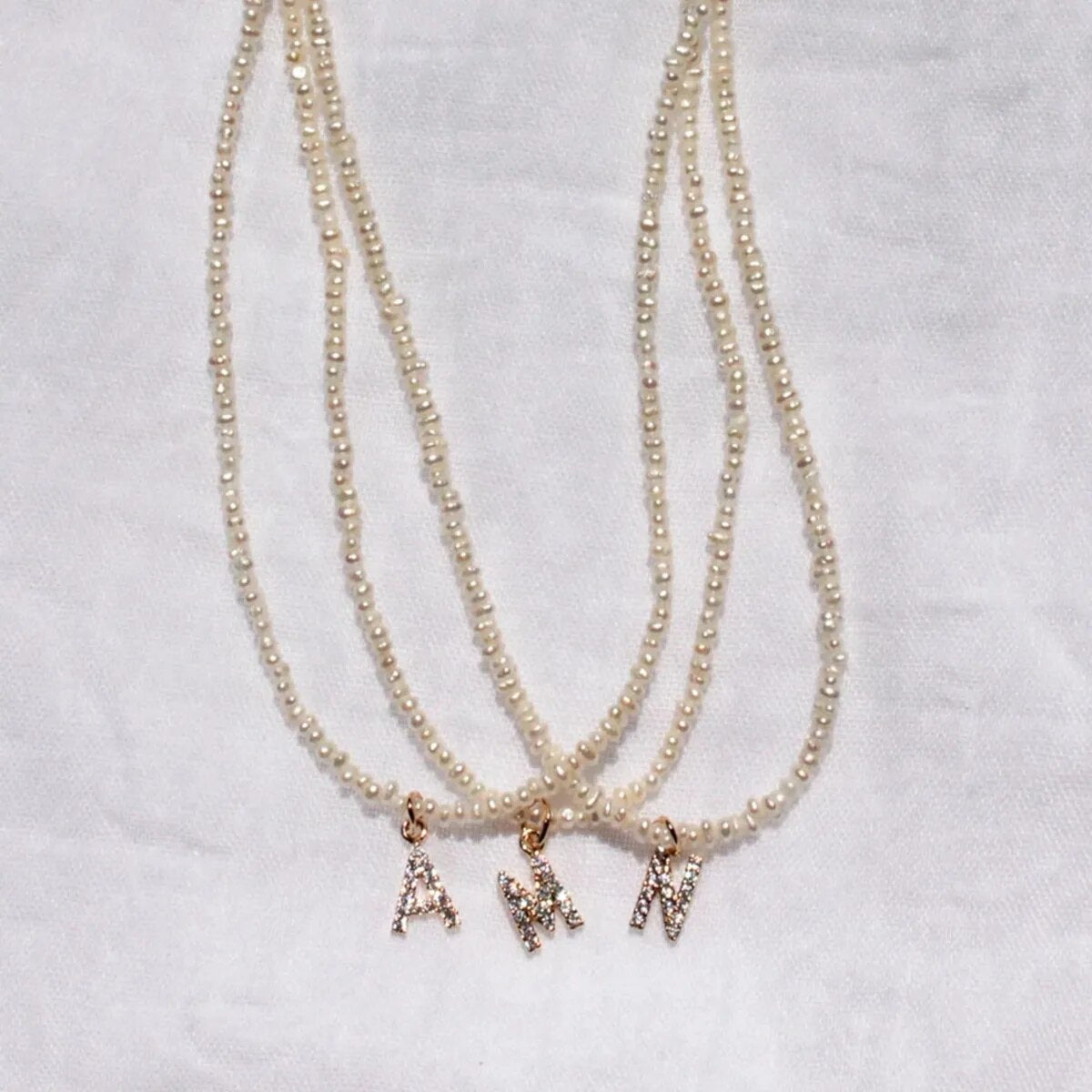 Miriam – Collana dorata doppia con pendente