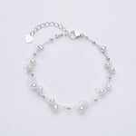 Marlena – Bracciale in oro con dettagli di perle.