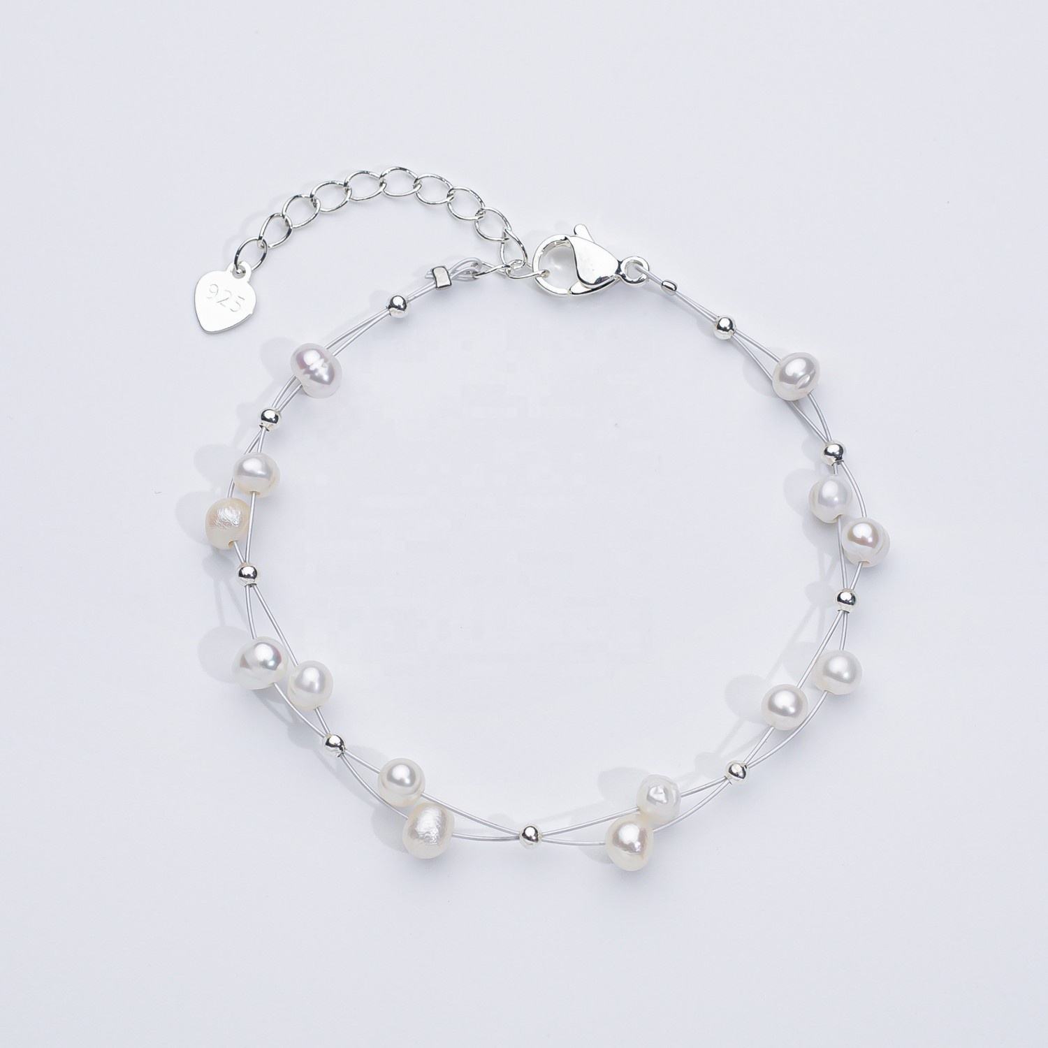 Marlena – Bracciale in oro con dettagli di perle.