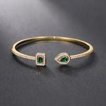 Klára – Bracciale aperto con estremità di smeraldo.