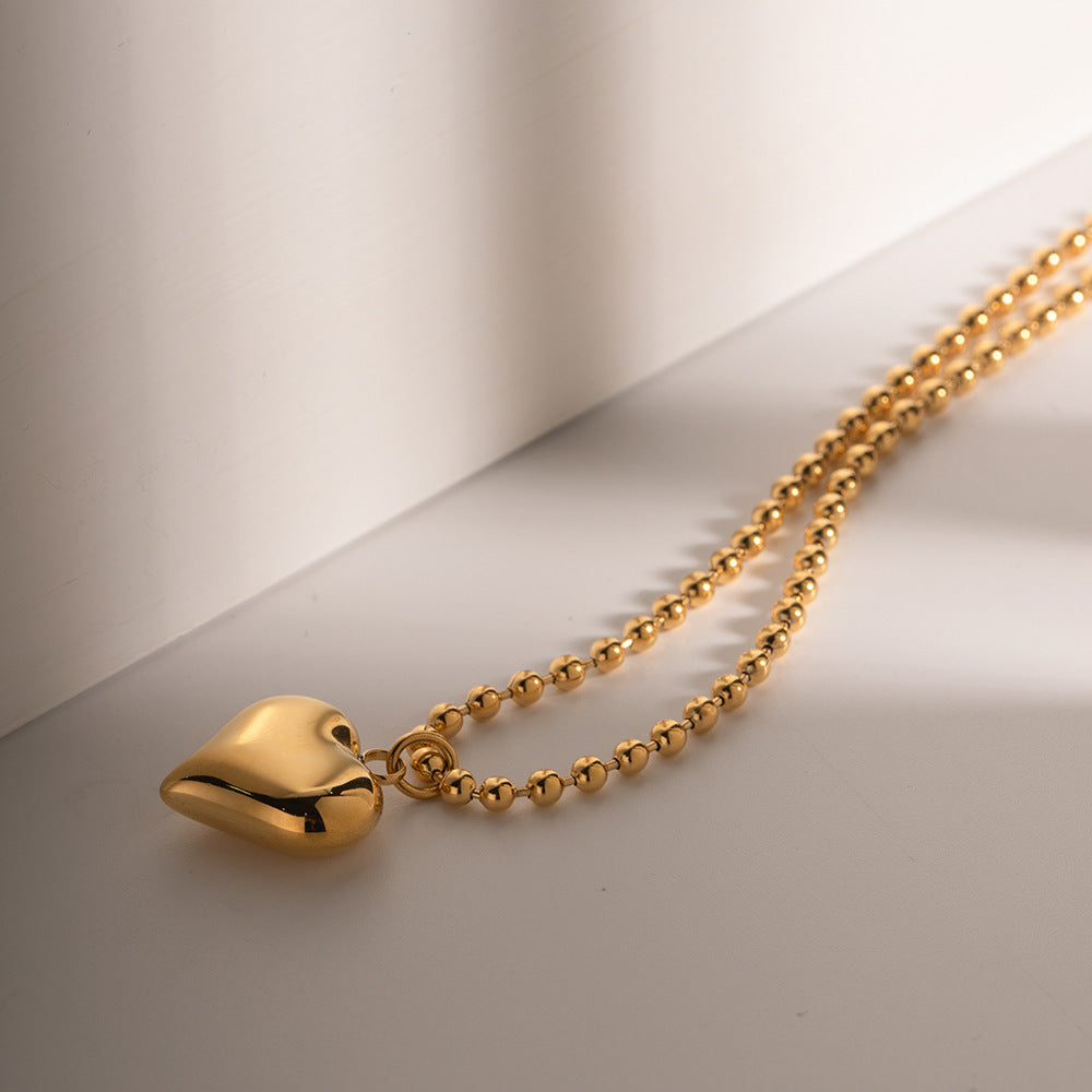 Amalia – Collana dorata con medaglione moderno