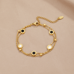 Carla – Delicato bracciale in oro con elementi rotondi a contrasto.