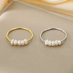 Rosalie – Anelli pendenti in oro con perla.