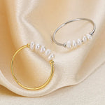 Rosalie – Anelli pendenti in oro con perla.