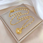 Beatrix – Collana dorata con pendente a forma di moneta
