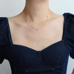 Carina – Collana dorata con accenti colorati
