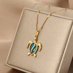 Maja – Collana dorata con medaglione rotondo
