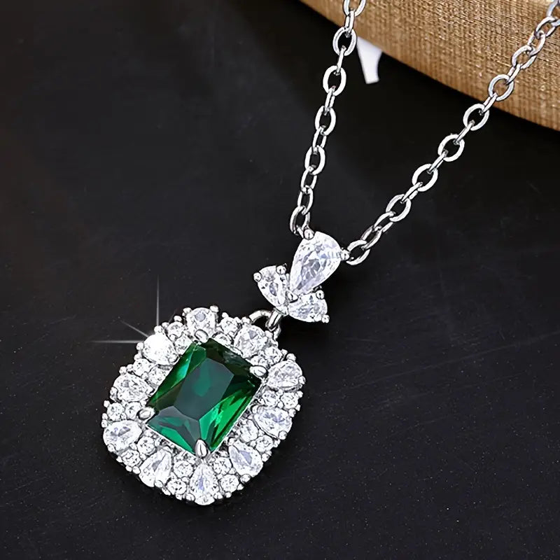 Elina – Ciondolo in argento con corona di smeraldi.