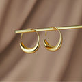 Carina – Mini cerchi dorati con una linea chiara.