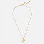Luisa – Collana dorata con elementi floreali simmetrici