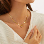 Eva – Collana dorata con pendente a iniziale