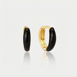 Theresia – Orecchini in oro dalla curva delicata.