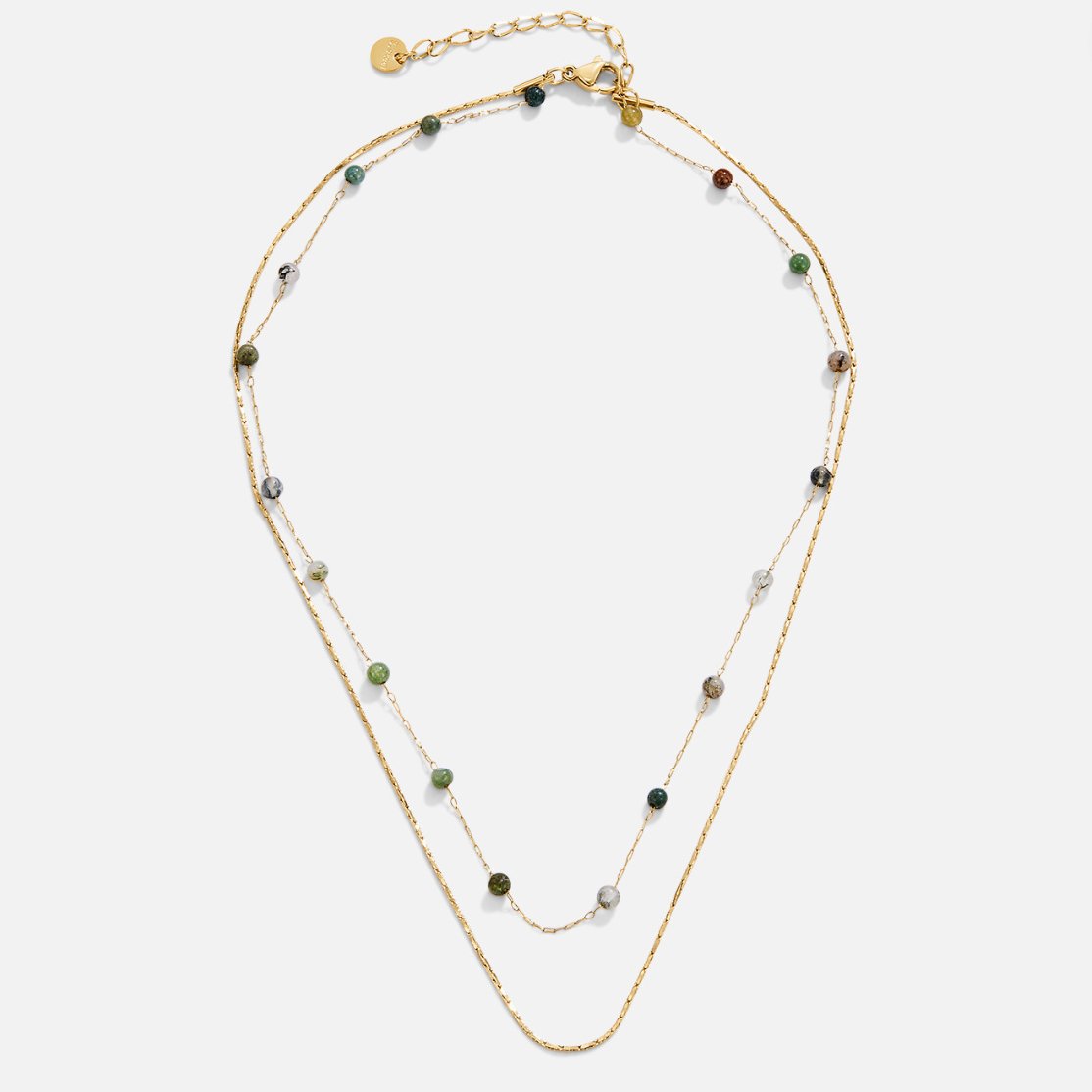 Helga – Collana a doppio strato con piccoli dettagli colorati.