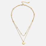 Leona – Collana dorata doppia con pendente rotondo