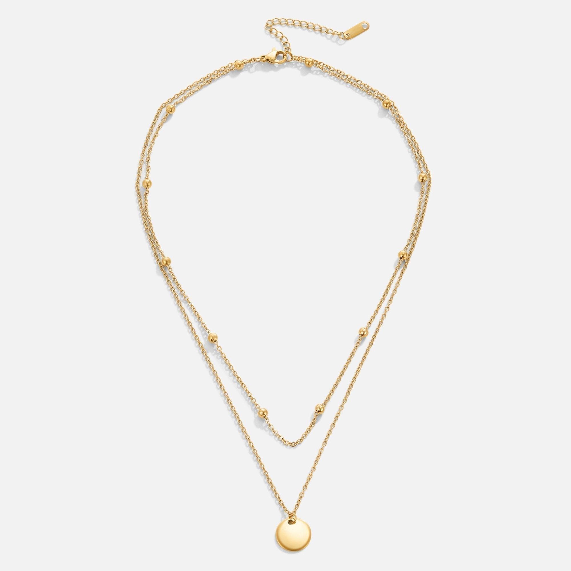 Leona – Collana dorata doppia con pendente rotondo