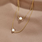 Nora – Collana dorata dal design a catena