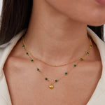 Jitka – Catena a maglie dorate dal design delicato.