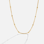 Fiona – Collana dorata con mini charm
