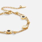 Carla – Delicato bracciale in oro con elementi rotondi a contrasto.