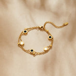 Carla – Delicato bracciale in oro con elementi rotondi a contrasto.