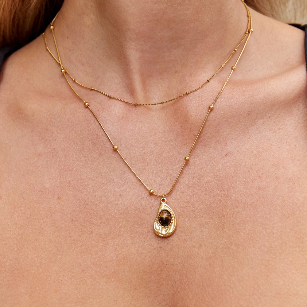 Leonie – Catena con pendente rotondo in oro.